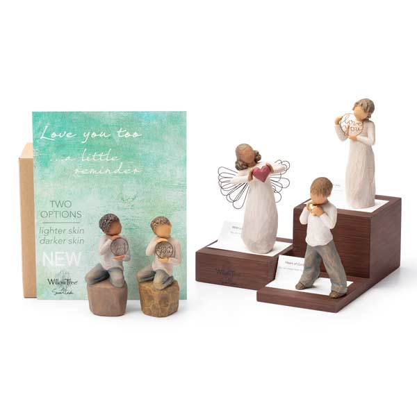 Willow Tree hand carved figurine setting on a folded card that displays the product name and bar code